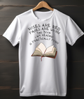 White t-shirt with a book graphic and humorous text on a wooden background